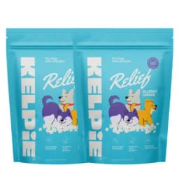 Two teal pouches of Kelp Pie Relief Allergy Chews for dogs with allergies, featuring cartoon illustrations of dogs
