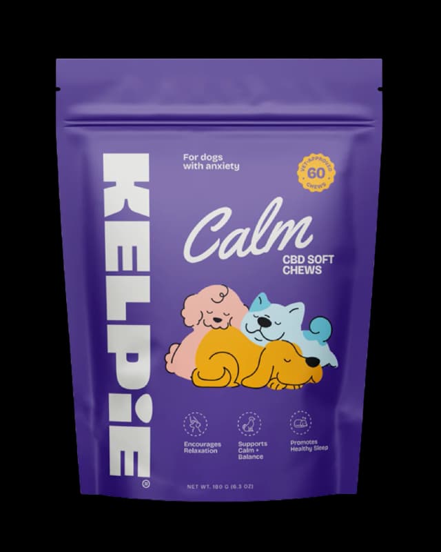 Purple package of CBD chews with whimsical illustrations of pink, yellow, and blue animals labeled 'Calm CBD Soft Chews' and 'For dogs with anxiety'.